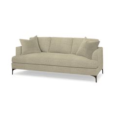 an image of a couch with pillows on the top and bottom half, in beige fabric