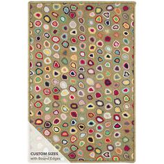 an area rug with various colored circles and shapes on the carpet, in beige tones