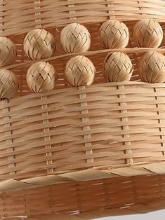 a close up of a basket with some balls on the top and bottom of it