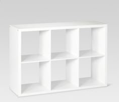 a white bookcase with six shelves on each side