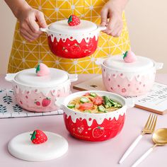 the woman is preparing her meal with strawberries and strawberrys on top of it