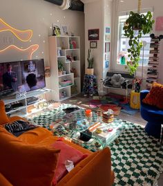 a living room filled with furniture and a flat screen tv