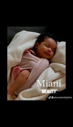 a baby wrapped up in a blanket with the words miami beauty on it's side