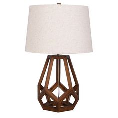 a wooden table lamp with a white shade