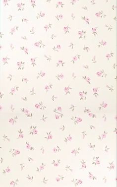 a white wall with pink flowers on it