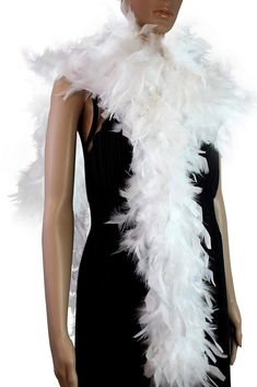 a mannequin wearing a white feather stole