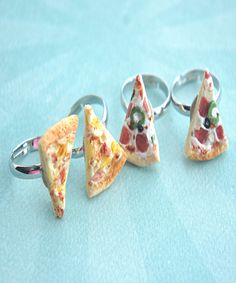 This friendship ring set features a pair of handmade pizza slices sculpted from polymer clay. Each pizza slice measures about 0.8" and is securely attached to an adjustable silver tone ring that fits most ring sizes. SKU 1440 Polymer Charms, Pizza Ring, Art Rings, Bff Rings, Handmade Pizza, Food Rings, Jewelry Clay, Friend Rings, I Love Pizza