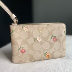 Bags Can Get Heavy Especially When Your On The Run. Check Out This Lightweight Floral Coach Wristlet. Material: Leather Brand: Coach Features: Zipper Top Closure, 2 Credit Card Slots, Wrist Strap Attachment Measurements: 6 1/4’’ (L) X 4’’ (H) X 1/2’’ (W) ~We Do Ship Out Same Day~ Wallets Coach, Pink Coach Pouch Wristlet, Pink Wallet Coach, Coach Floral Wallet, Coach Floral, Aesthetic Bags, Purse Essentials