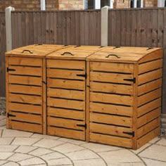 a large wooden box sitting on top of a patio