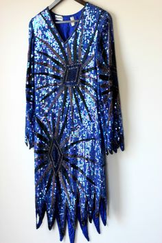 "Fun and funky Vintage Sequin Flapper inspired dress..timeless style for your one of a kind type of night.. This slips over the head. All the beads and sequins are in Very Good condition..i do not see any missing..although i might have missed something..this is all silk..beads and sequins. Lovely Zig zag hem. This is very small. It is a straight dress..so if you want it to fit loose, remember those measurements. Measuring: 36\" - 38\" long (zig zag hem) Sleeves: 22\" Width: Bust/hip/waist: 34\" Royal Blue Sequin Dress, Flapper Inspired Dress, Blue Sequin Dress, Flapper Style, Straight Dress, Inspired Dress, Gatsby, Sequin Dress, Zig Zag