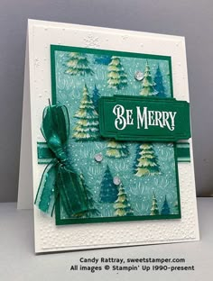 a handmade christmas card with pine trees and the words be merry written on it