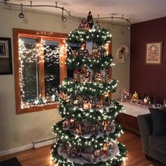 a christmas tree is decorated with lights and ornaments