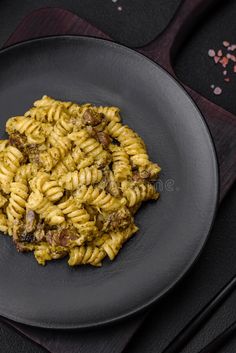 Delicious fusilli pasta with green pesto sauce, with salt and spices royalty free stock photos Brown Butter Sage Pasta Sauce, Pasta Pesto Photography, Old Spaghetti Factory Creamy Pesto, Pesto Pasta Pine Nut