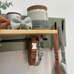 several different types of bow ties hanging on a shelf