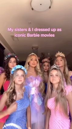 a group of young women standing next to each other in front of a sign that says my sisters & i dressed up as iconic barbie movies