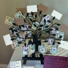 a money tree with lots of notes attached to it