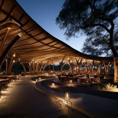 an outdoor dining area lit up at night