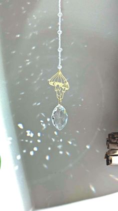 a white bath tub sitting next to a window covered in raindrops and beads