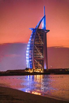 the bur is lit up at night on the beach