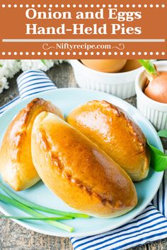 two buns on a plate with eggs in the background