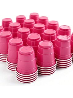 many pink cups are lined up in rows