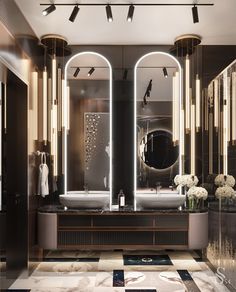 a bathroom with two sinks, mirrors and lights on the wall above it is an area rug that has black and white checkered flooring