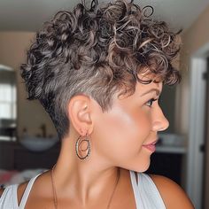 Curly Pixie with Tapered Sides Perms Short Hair Women, Curly Gray Pixie, Short Hair Styles For Curly Hair Over 50, Womens Short Curly Hair, Thick Short Curly Hair, Naturally Curly Pixie Haircut, Short Curly Hair Shaved Side, Shaved Sides Curly Hair, Short Curly Haircuts Pixie