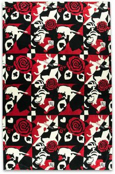 a red and black rug with skulls and roses on the front, in different colors