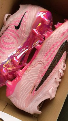 the pink nike air max sneakers are in a box with its shoe laces down