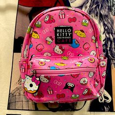 Hello Kitty Cafe Mini Pink Backpack. Sanrio And Friends Hello Kitty Cafe Special Edition Backpack. Pink Pleather With A Black Backing And Straps. Many Of Sanrio Characters. Keroppi Kuromi My Melody Pompompurin Tuxedo Sam Cinnamoroll Donuts Cupcakes And More! Super Cute! Nwt From Claire's. Kawaii Pink Backpack With Cute Design, Pink Kawaii Backpack With Cute Design, Pink School Bag With Cartoon Print, Cute Hello Kitty Print Bag For Students, Cute Hello Kitty Print Student Bag, Pink Hello Kitty School Backpack, Cute Pink Bags With Cartoon Print, Pink Cat Design Backpack For Everyday Use, Pink Cat Design Backpack For Daily Use