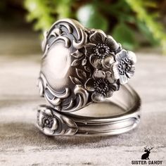 two rings with flowers on them sitting next to each other