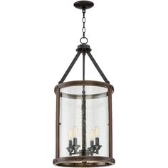 a light fixture with three lights hanging from it's center and two small candles in the