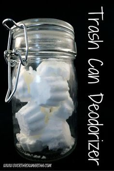 a glass jar filled with marshmallows and whipped cream