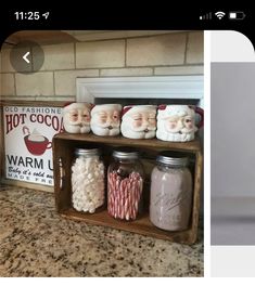 a shelf filled with different types of candy and santa clause jars on top of a counter