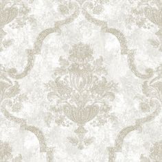 an ornate wallpaper pattern in beige and white