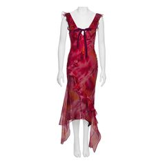 This silk organza dress features a fitted, sleeveless silhouette with a deep V-neckline and an asymmetrical hemline. It showcases vibrant tie-dye colors in red, pink, and orange with abstract, painterly patterns. The dress is adorned with ruffled detailing and a velvet ribbon bow at the centre of the neckline. ▪ Brand: Christian Dior ▪ Creative Director: John Galliano ▪ Collection: Spring-Summer 2001 ▪ Fabric: Silk Organza with Silk Lining ▪ Size: FR40 - UK12 - US8 ▪ Made in: France ▪ Condition: John Galliano Dior Haute Couture, Organza Ruffle Dress, Silk Organza Dress, Galliano Dior, Dior By John Galliano, Evening Mini Dresses, 20th Century Fashion, Dye Colors, Dior Haute Couture