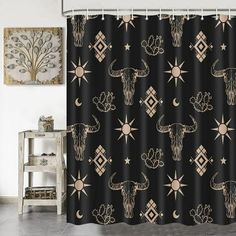 a shower curtain with an animal head and stars on the black background, in front of a white chair