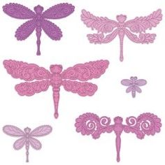 some pink and purple paper cut outs with dragonflies on the top, one in the middle