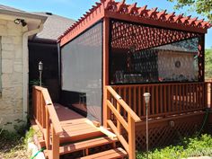 a gazebo sitting on top of a wooden deck