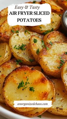 air fryer sliced potatoes on a white plate with parsley and ketchup