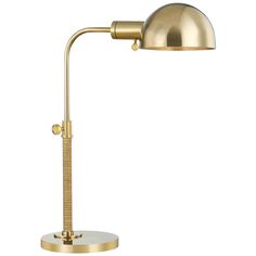 a gold desk lamp on a white background