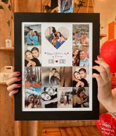 a woman holding up a framed photo with photos on it and balloons in front of her