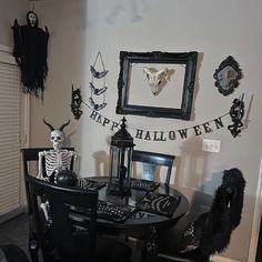 a dining room decorated for halloween with decorations