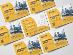 four yellow business cards with the words creative marketing agency written on them, and an image of a man sitting in a chair