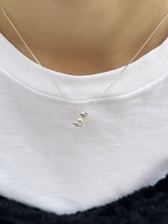 Editor's NotesInvisible collage presents a cute double-heart pendant necklace. It adds a lovely touch to your overall appearance. - Double-heart pendants- Box chain- Smooth glossy surface- Sleek silhouette- Made of silver 925- Lovely and casual mood Measurements(in.)One Size- Size: 15.35 ~ 16.54 in. (L) Composition & Care- Material: Sterling Silver, Cubic- Plated products may discolor over time due to their nature.- Please be careful that discoloration may proceed fa Affordable Silver Double Heart Necklace, Luxury Dainty Double Heart Necklace, Minimalist Heart Necklace, Cheap Silver Charm Necklace For Women, Affordable Classic Silver Charm Necklaces, Pretty Dainty Necklaces, Cheap White Hypoallergenic Charm Necklaces, Delicate Pendant Necklace, Necklaces From Boyfriend