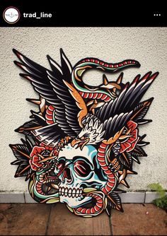 a skull with an eagle and snake on it