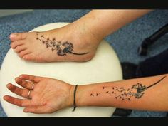 two people with matching tattoos on their arms and feet, one has a dandelion tattoo