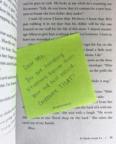 an open book with a sticky note attached to it