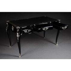 a black and white table with two drawers on each side, in the shape of a desk