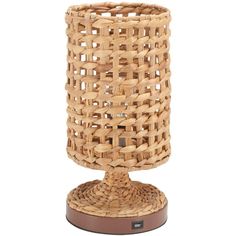 a wicker candle holder on a wooden base with a brown rubber pad underneath it